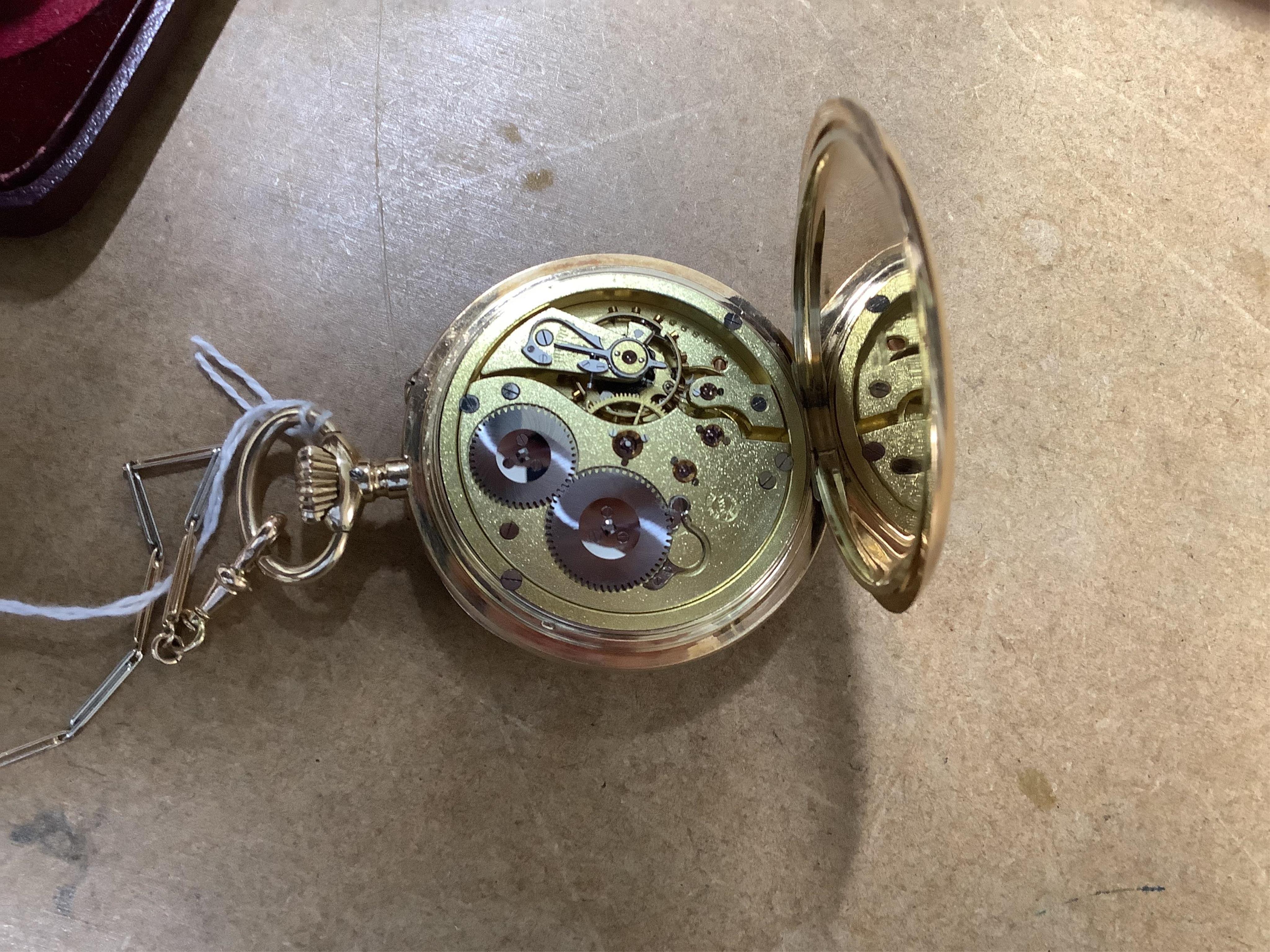 An early 20th century International Watch Company engine turned 14k yellow metal open faced keyless lever pocket watch, together with a Viennese? two colour yellow metal albert, maker's mark, LE